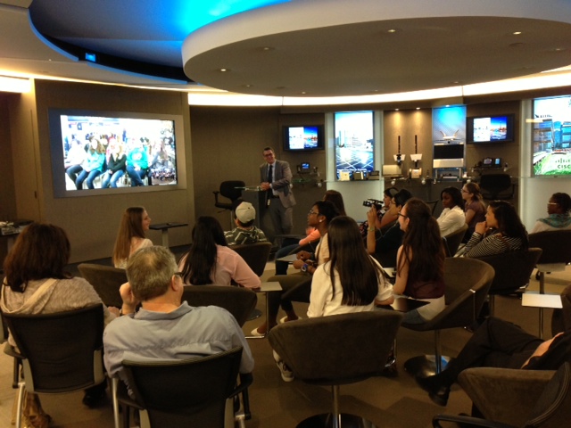 Aqsarniit Ilinniarvik Middle School students gather around Cisco TelePresence to connect live with students from Kawartha School District.